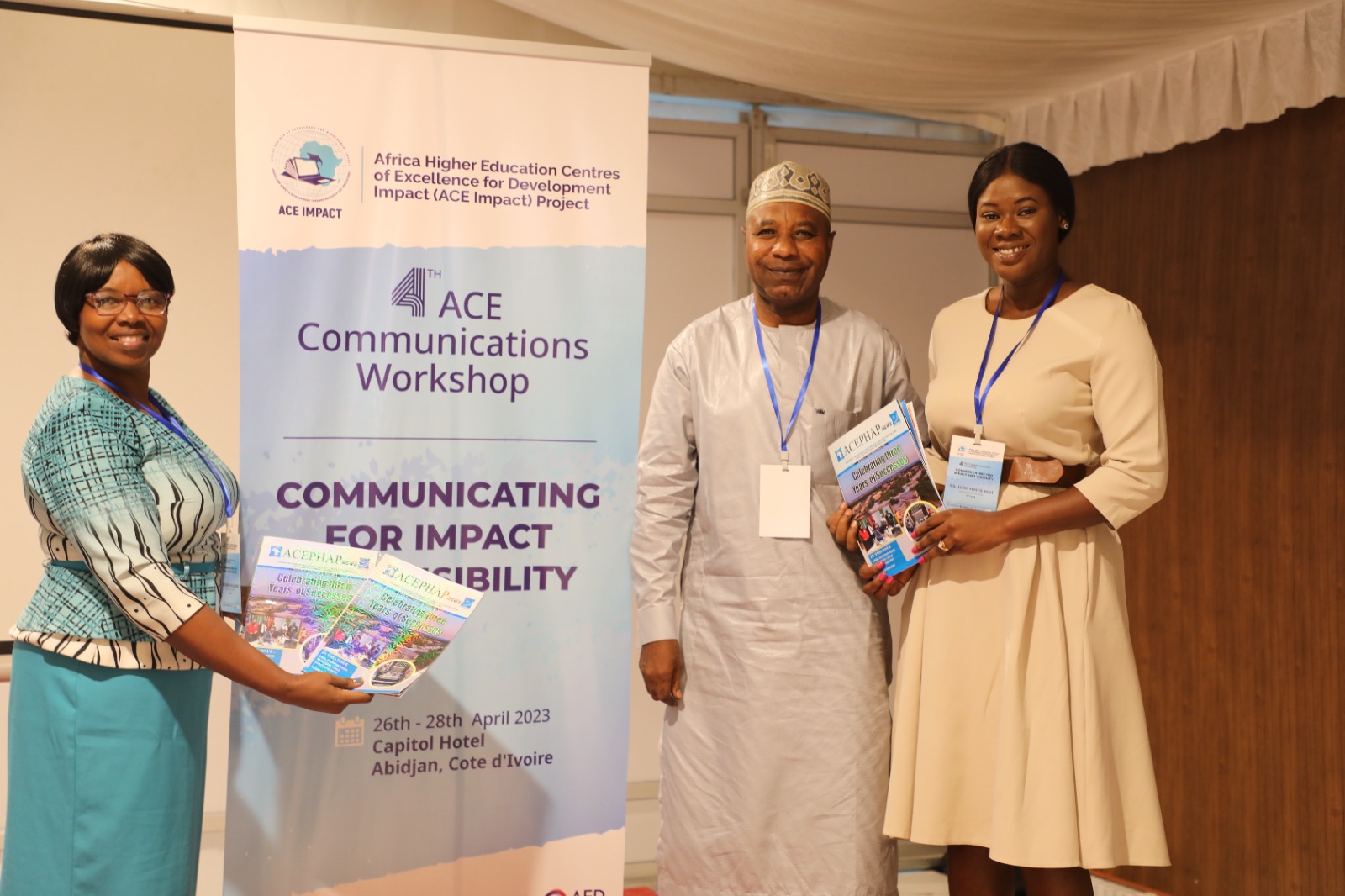 ACEPHAP Communication Officer, Bala Garba Abdullahi presenting copies of the maiden edition of ACEPHAP Newsletter to ACE IMPACT AAU Communication Officer, Ms. Milicent while ACE IMPACT AAU director of ICT, Ms. Nodumo Dlamini displays more copies.