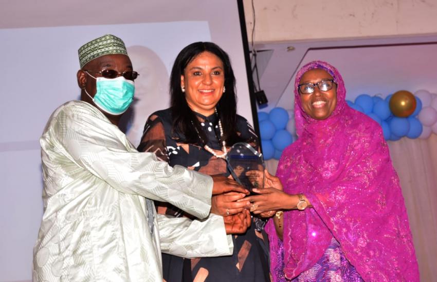 The Guest Lecturer, Mrs. Clare Omotseye (middle) receiving her award from Prof. Hamisu Salihu and assisted by Prof. Hadiza Galadanci (right)